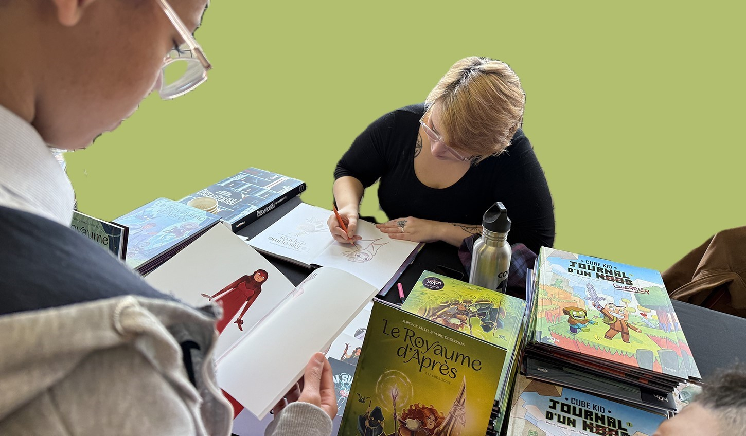 un auteur bd en dédicace